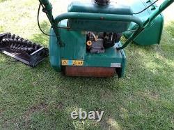 Qualcast Classic 35S Petrol Self Propelled mower with a scarifier cassette